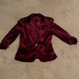 Burgundy blazer with a bejeweled button.